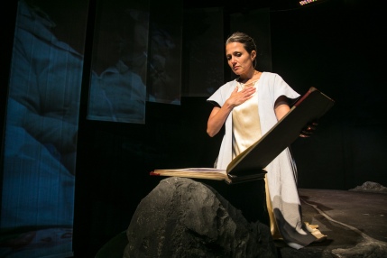 San (Nora el Samahy) reading The Way of Liv. Photo by Cheshire Isaacs for Crowded Fire Theater.