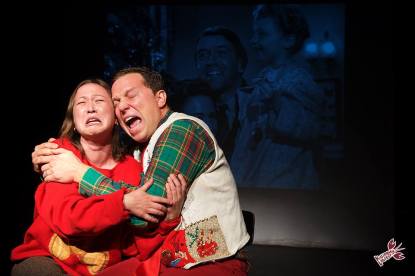 Two millennials (Jenny Nelso and Max Maliga) cry not-so-ironic tears at this holiday classic. Photo by Matthew Davis.