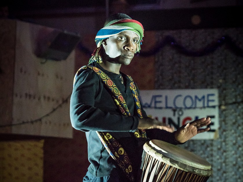 Even Okot (John Pfumojena) finds a moment for music. Photo By Marc Brenner